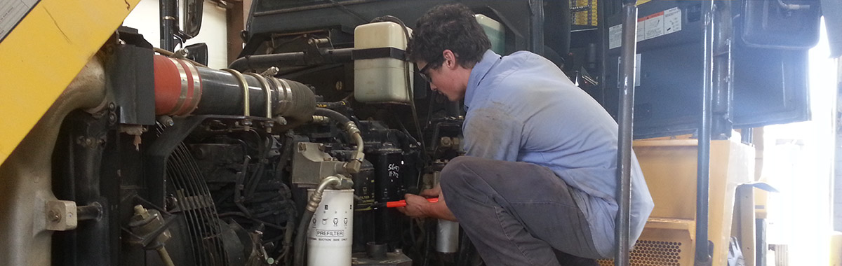 Certified technician working on equipment