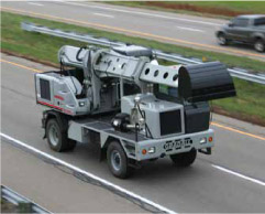 Gradall excavator driving on highway