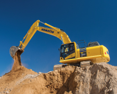 Komatsu excavator dumping dirt