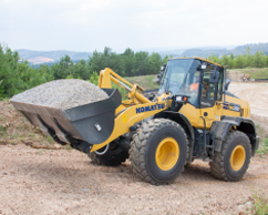 Komatsu wheel loader with load of dirt